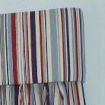Fabric covered pelmet with bump, where pattern matches curtains.