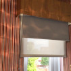 Veneer finish against striped wallpaper