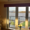 Customers image of their fabric covered pelmet looking out at Renfrewshire